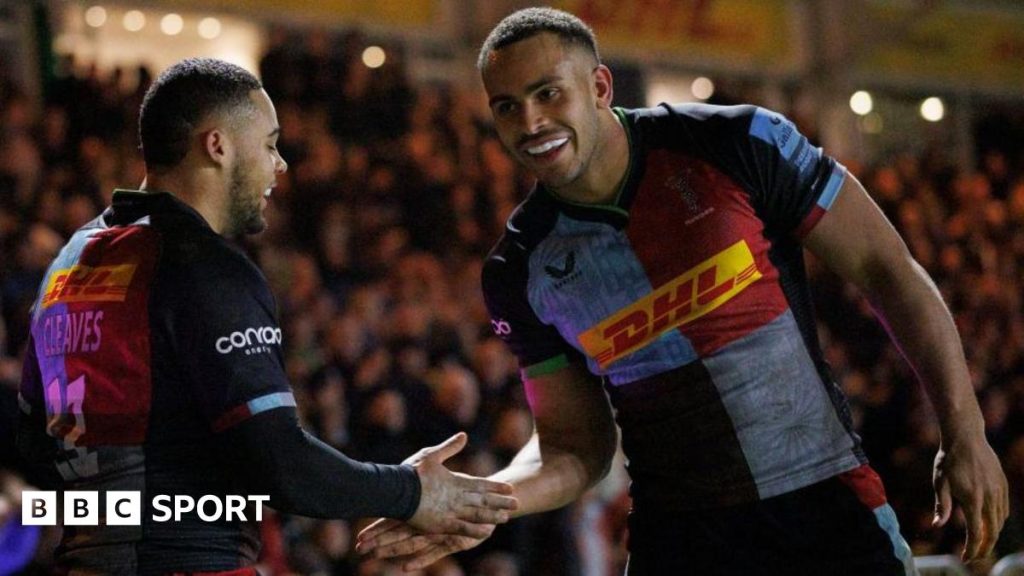 Cassius Cleaves [left] and Will Joseph [right] celebrate after Cleaves scores for Harlequins against Northampton