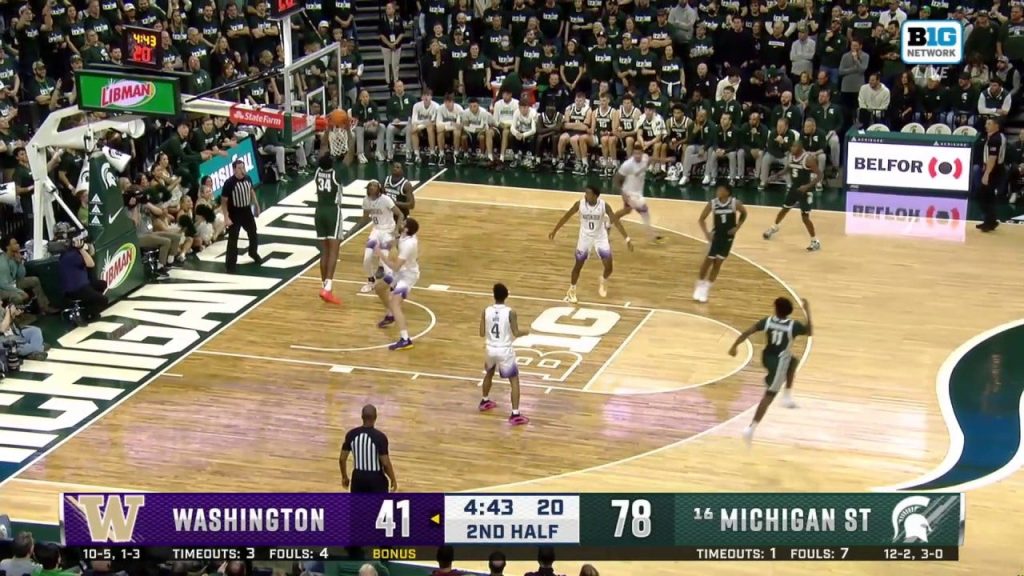 Xavier Booker melakukan alley-oop dengan dua tangan yang kuat untuk memastikan kemenangan 88-54 Michigan State atas Washington